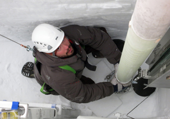 Lead driller Tanner Kuhl guides the Intermediate Depth Drill into position to start ice-coring operations