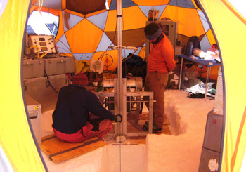 Mike Waszkiewicz (L) and Brad Markle (R) inside the drill tent with the Eclipse Ice Drill