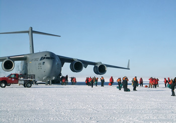 Passengers disembark from an Air Force C-17 Globemaster aircraft near McMurdo Station in the 2011 photo