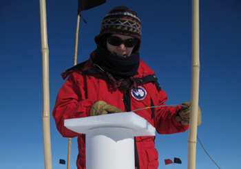 Anais Orsi adjusting the depth of the borehole thermometer at WAIS Divide, Antarctica.