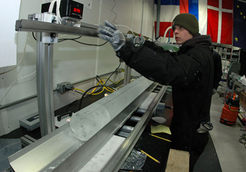 National Ice Core Lab intern Mick Sternberg measures the final section of ice core from the WAIS Divide project