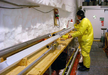 Pushing an ice core out of the drill