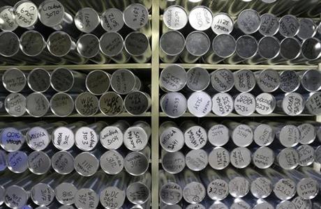 This Aug. 8, 2016 photo shows some of the thousands of frozen ice cores stored in canisters inside the minus-33 degree environment of the archive warehouse at the National Ice Core Laboratory, in Lakewood, Colo