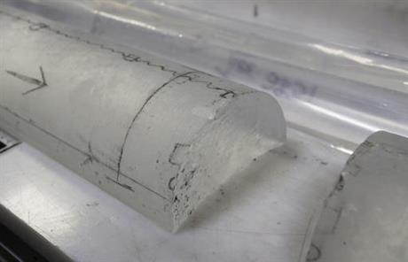 This Aug. 8, 2016 photo shows an arctic ice core on a table inside the deep freeze work area at the lab, in Lakewood, Colo