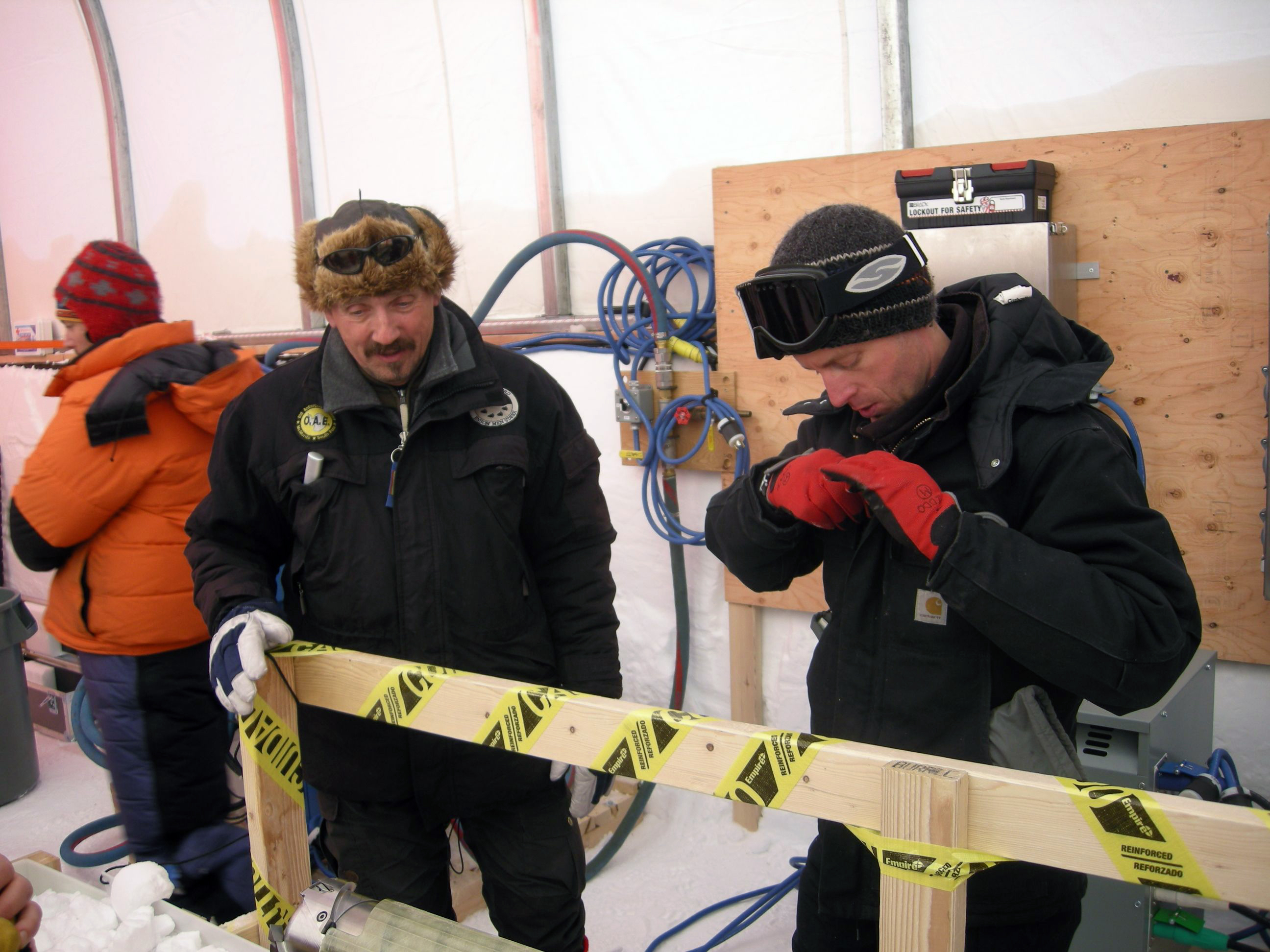 Jay Johnson, drilling engineer for Ice Drilling Design and Operations group at the University of Wisconsin-Madison (right) discussing the drill operations with Steffen Bo Hansen from the Centre for Ice and Climate, Copenhagen