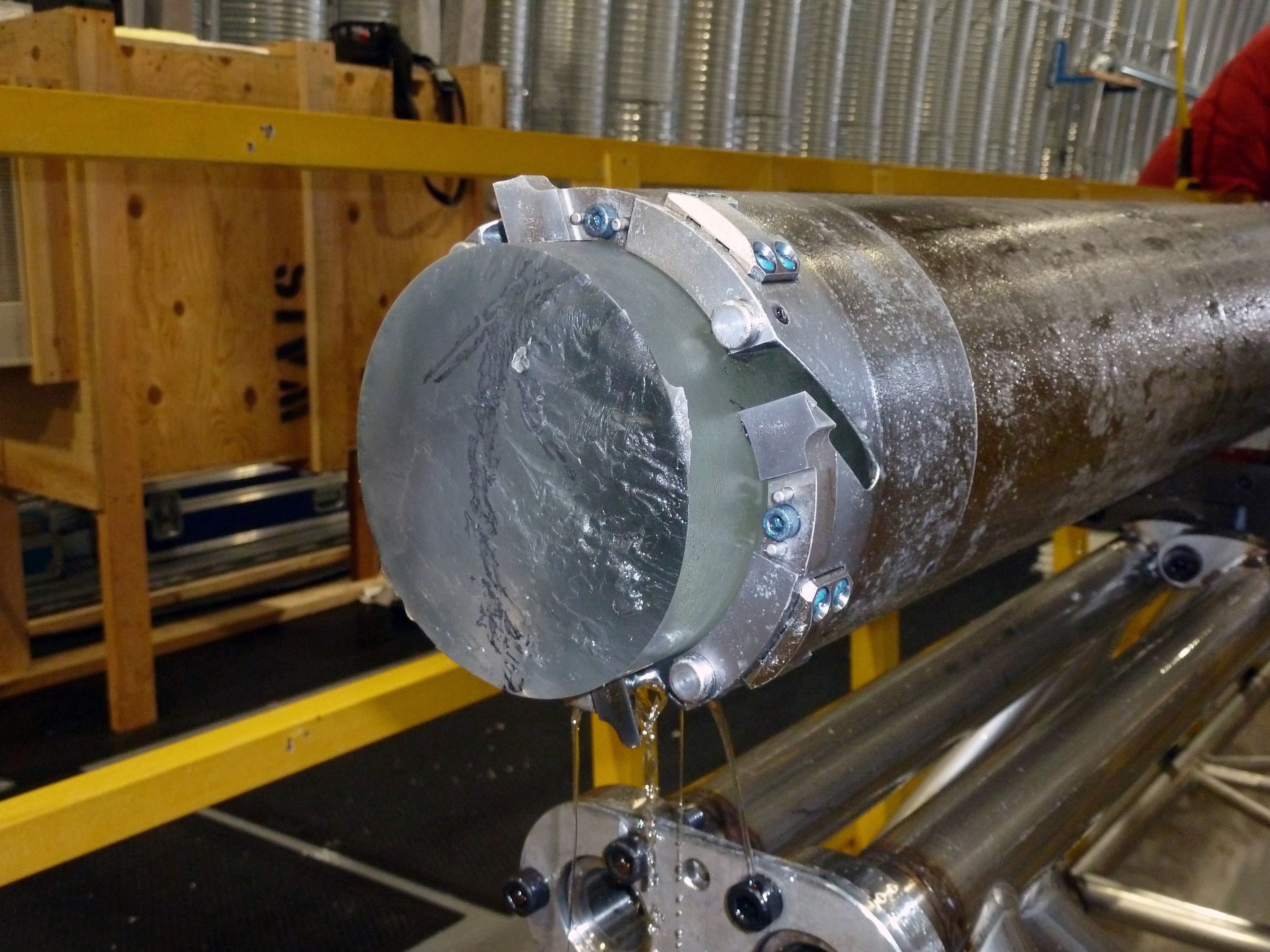The DISC Drill's cutter head and core barrel with an ice core inside