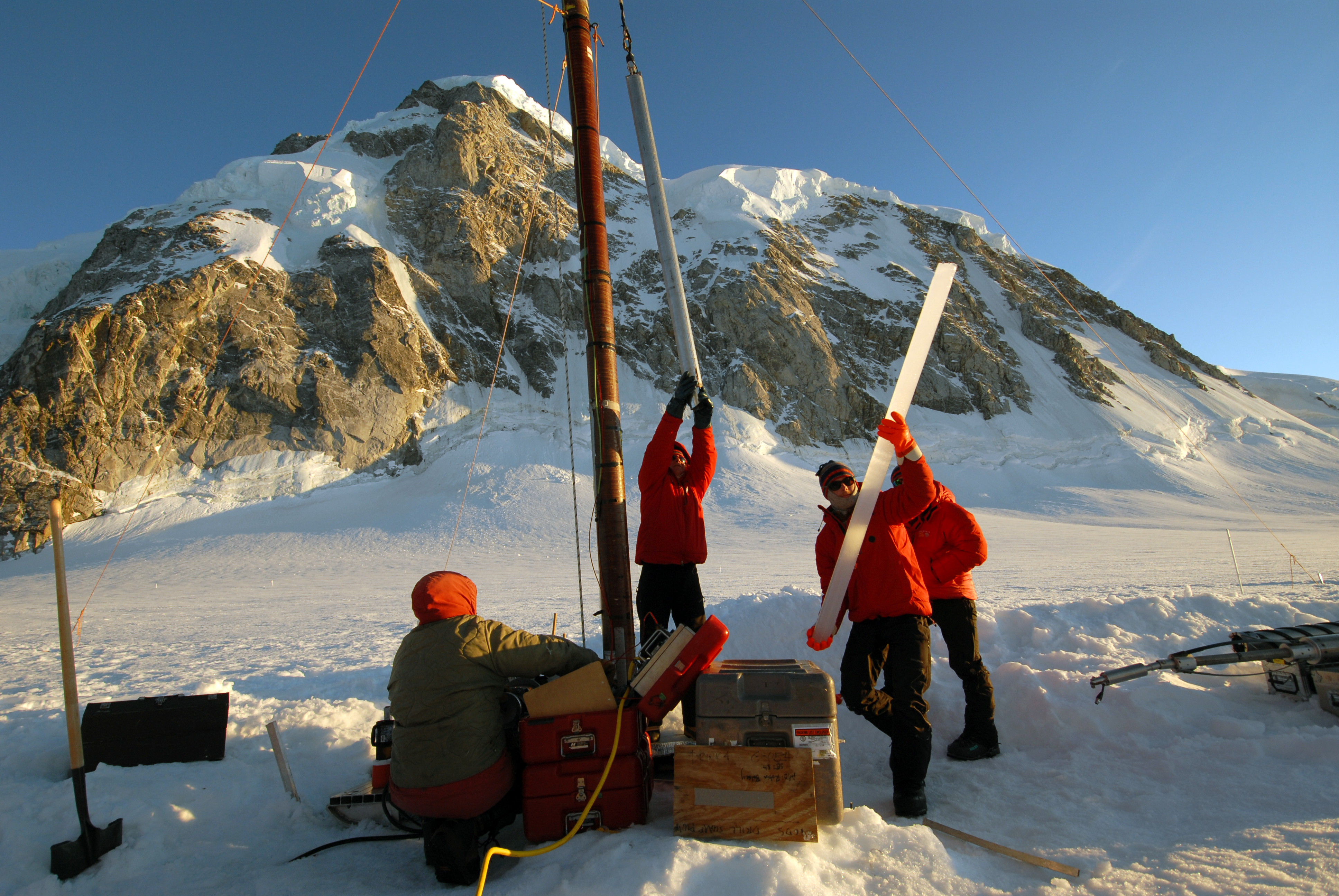 A 2-meter section of ice core from Combatant Col, British Columbia, is removed from an electrothermal drill