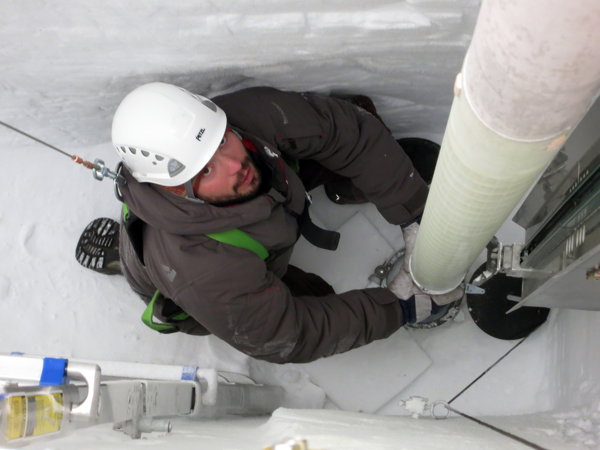 Lead driller Tanner Kuhl guides the Intermediate Depth Drill into position to start ice-coring operations