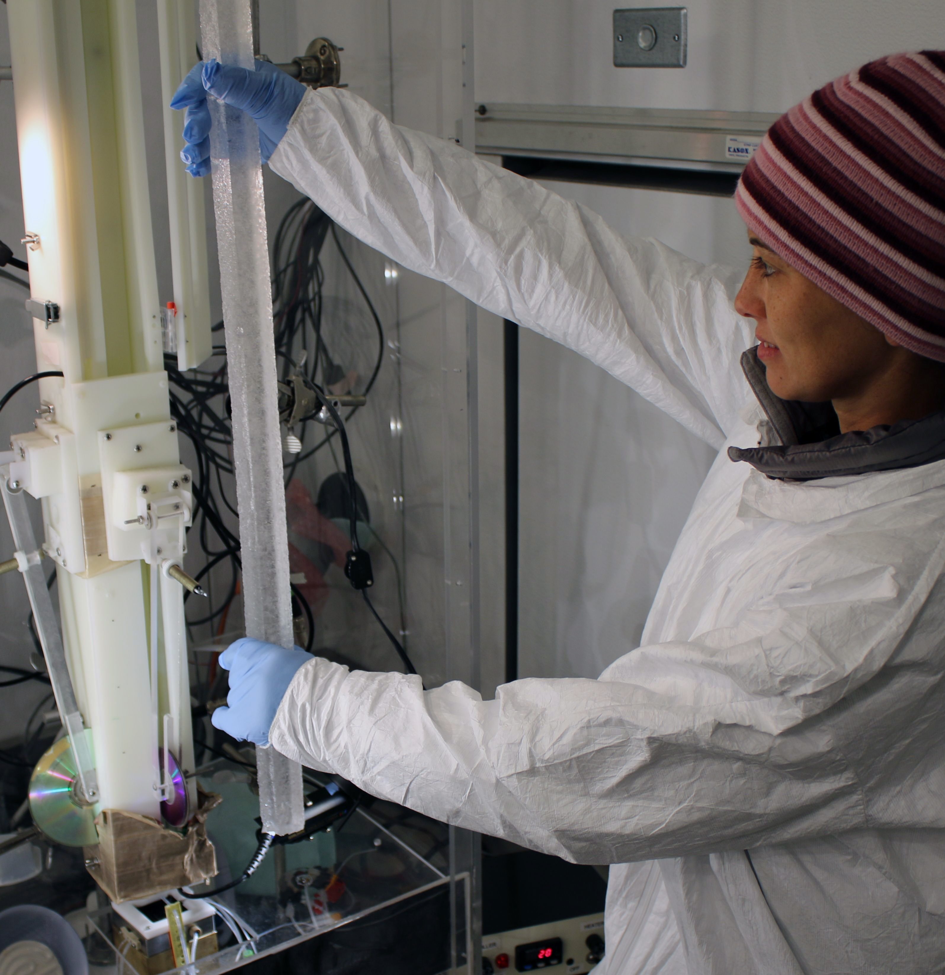 Monica Arienzo, Ph.D., an assistant research professor of hydrology at DRI, loads an 18,000-year-old sample of the WAIS Divide ice core for continuous chemical analysis