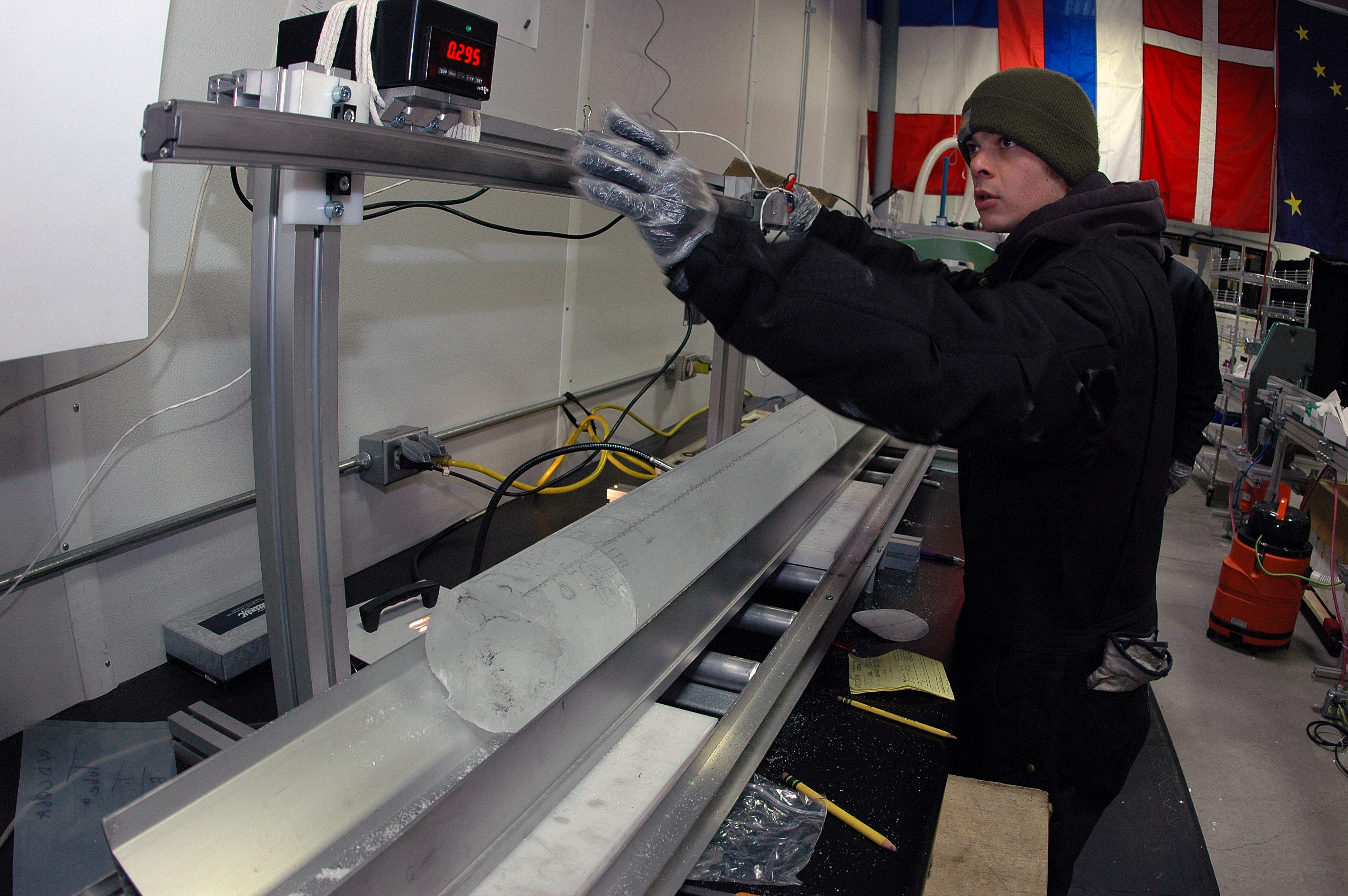 A NSF-ICF staff member measures a section of the WAIS Divide ice core as it begins its journey down a CPL