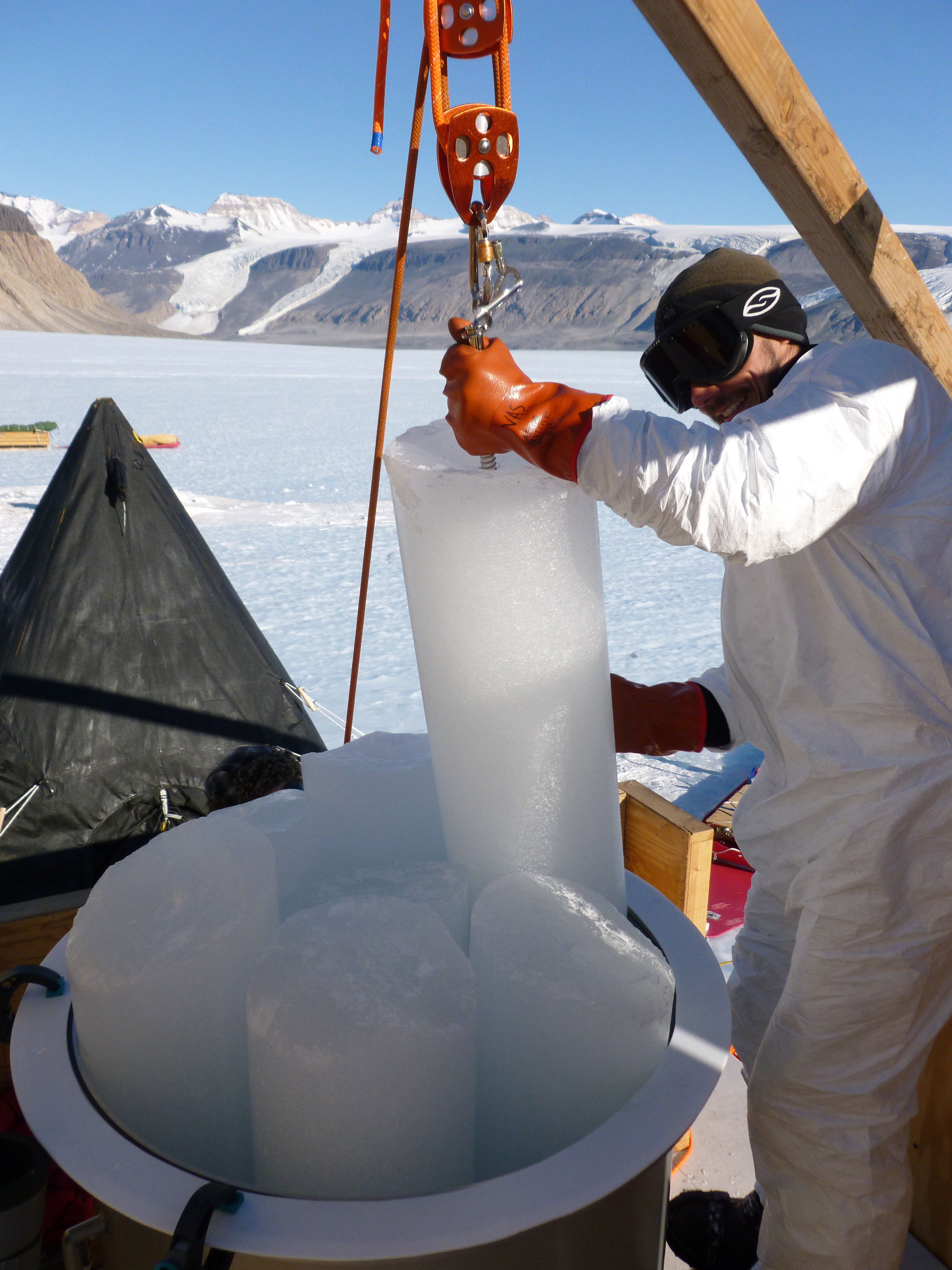 Vasilii Petrenko loading an ice core into the melting chamber for extraction of trapped ancient air