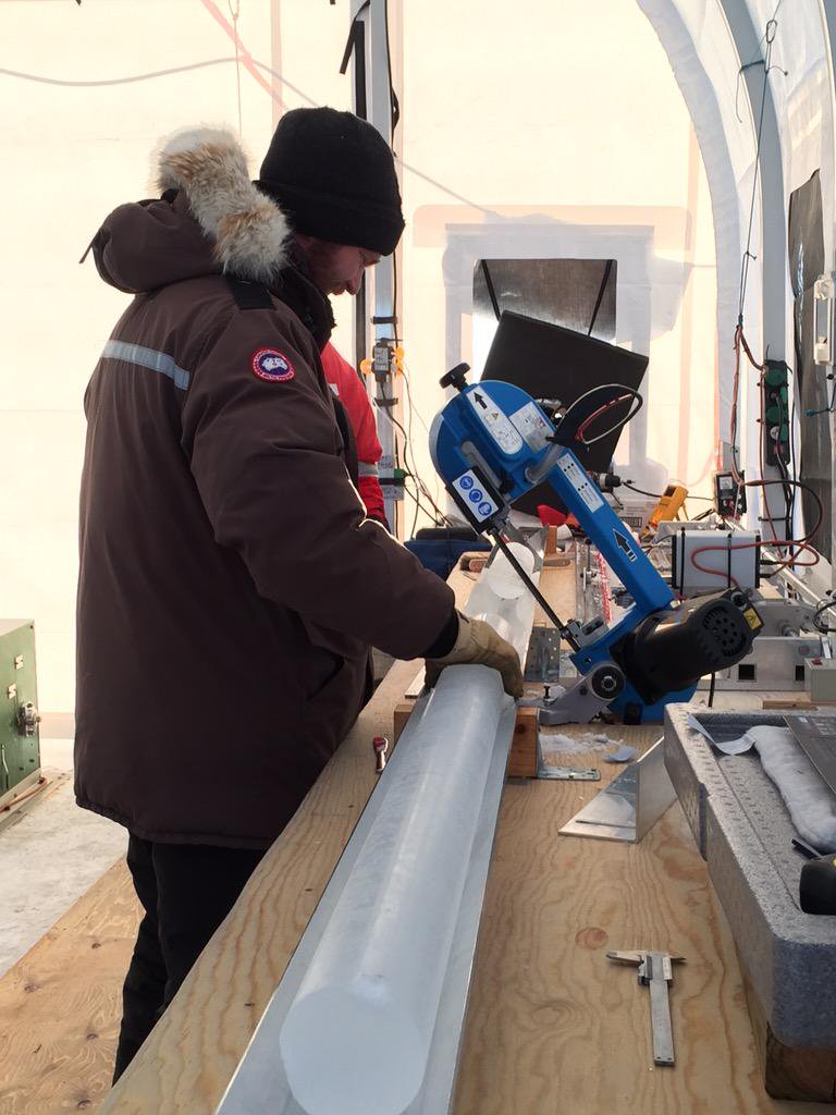 RECAP Chief Scientist Bo Vinther cuts a section of the freshly-drilled ice core