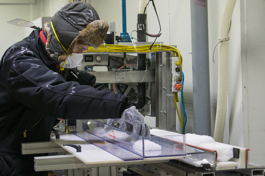 Richard Nunn, the assistant curator at the National Ice Core Laboratory, slices up recently acquired ice core samples