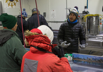 Luke Trusel of the Woods Hole Oceanographic Institute describes to School of Ice participants how he and his colleagues store and process ice cores at the National Ice Core Laboratory