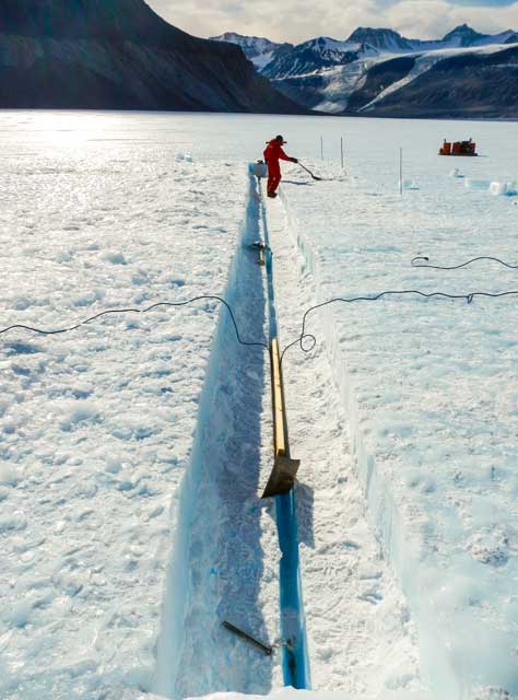 A trench is cut in the top of Taylor Glacier as part of the project looking for ice of a certain age containing dust grains