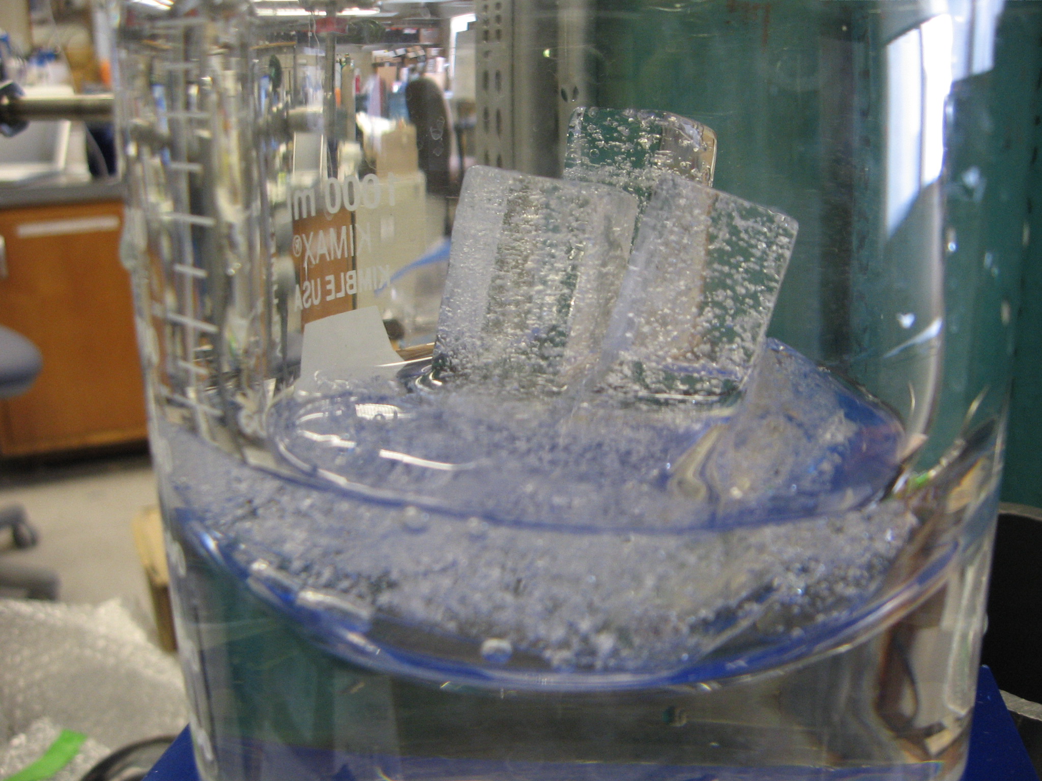 An ice core sample melts under vacuum to release the ancient air bubbles for isotopic analysis at a lab