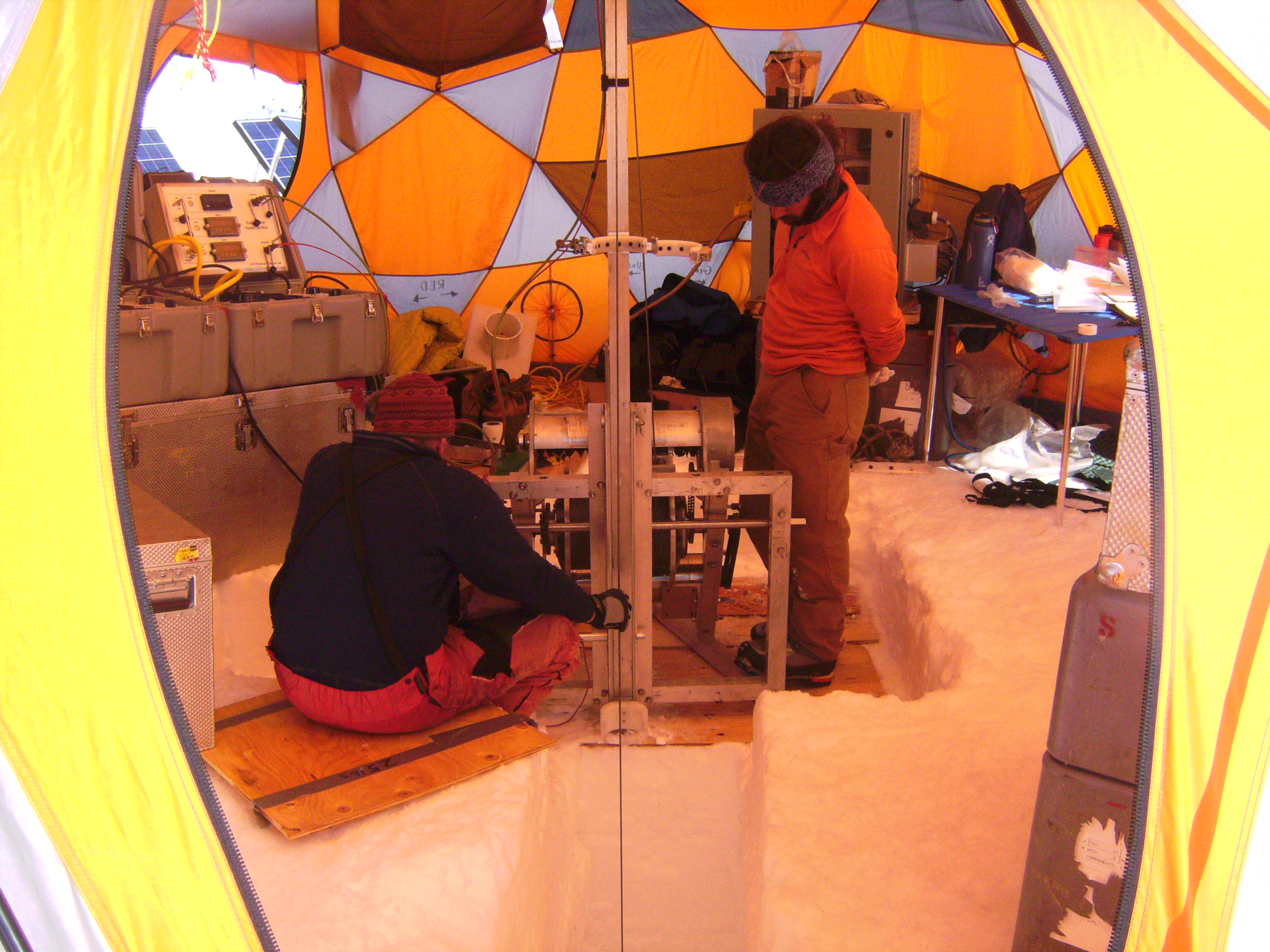 Mike Waszkiewicz (L) and Brad Markle (R) inside the drill tent with the Eclipse Ice Drill
