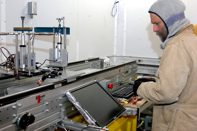 Ken Taylor, chief scientist of the WAIS Divide Ice Core project from the Desert Research Institute, monitors an instrument that measures electrical conductivity in the ice, a key piece of information for defining and dating the layers of the ice core