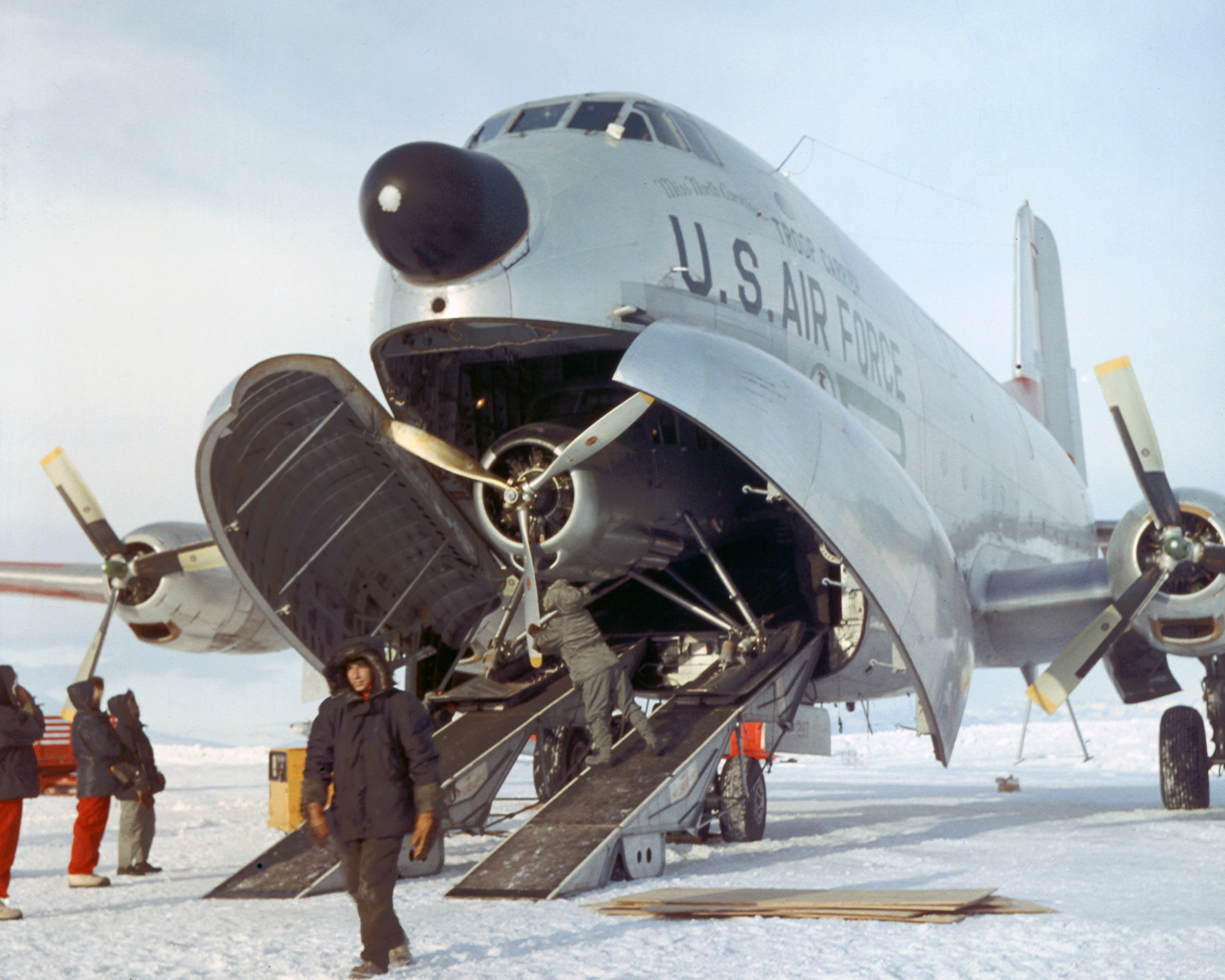 A U.S. Air Force C-124 Globemaster delivers an airplane to McMurdo Station, Antarctica, in 1956