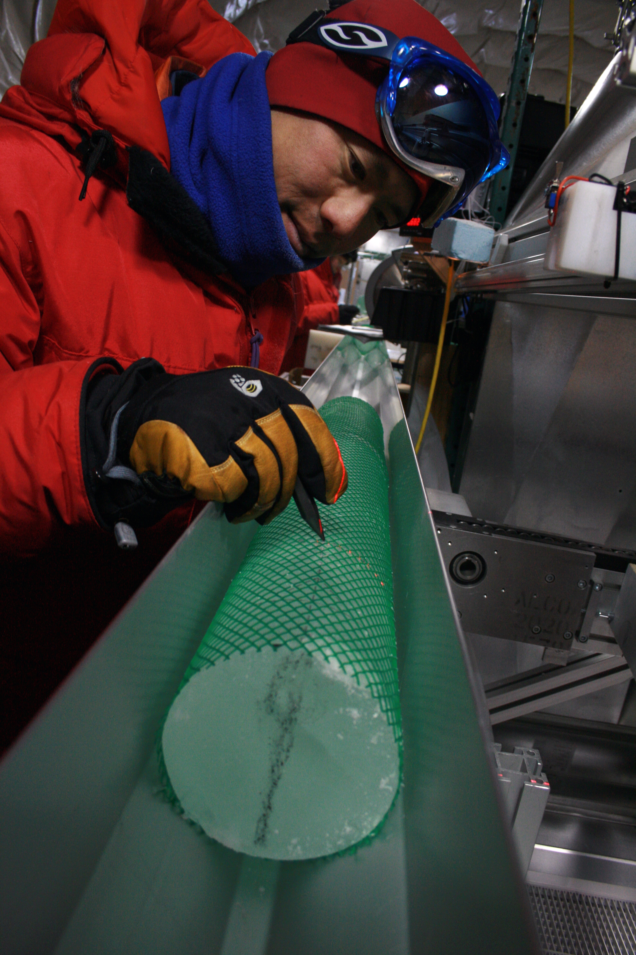 Gifford Wong examines an ice core